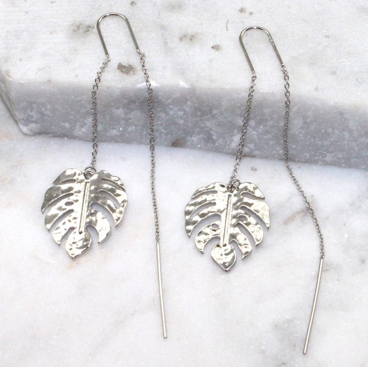 A photo of the Monstera Threader Earrings product