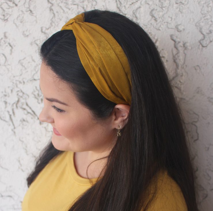 A photo of the Mustard Twist Headband product