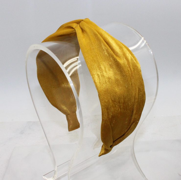 A photo of the Mustard Twist Headband product