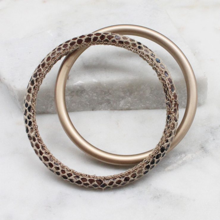 A photo of the Slithering Through Bangle Set In Brown product
