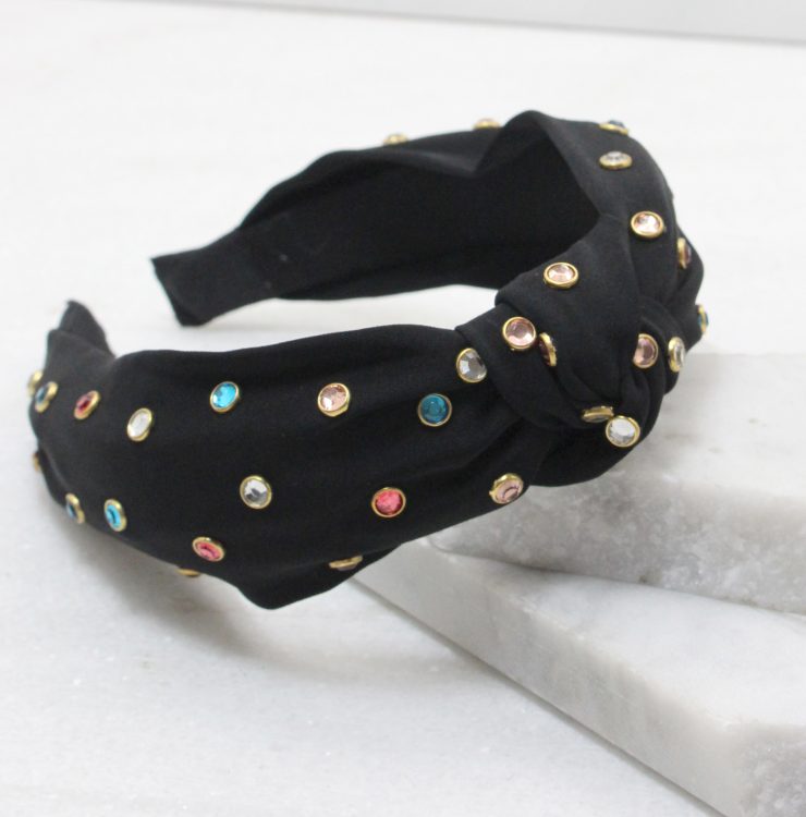 A photo of the Studs and Knots Headband in Black product