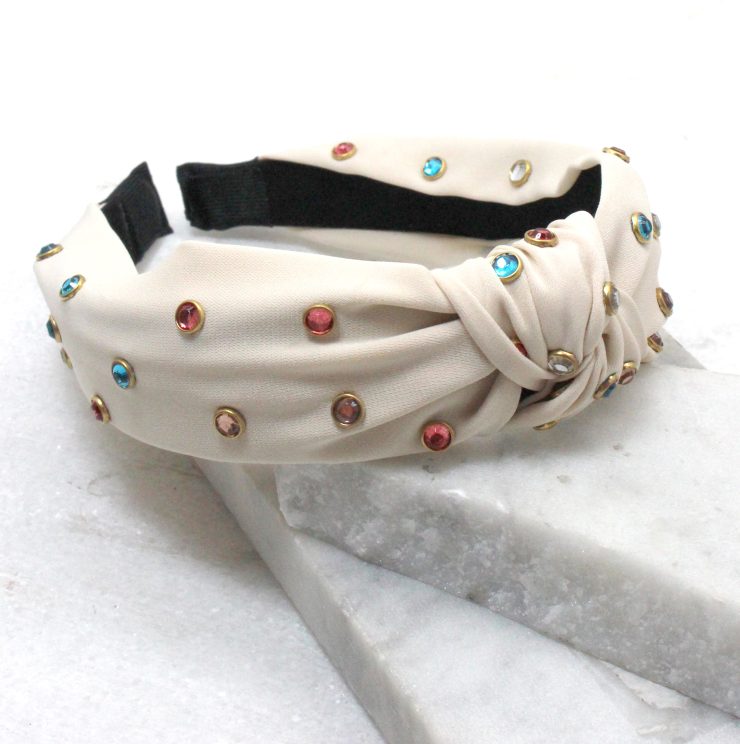 A photo of the Studs and Knots Headband in Black product