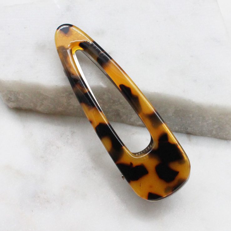 A photo of the Tortoise Shell Hair Clip product