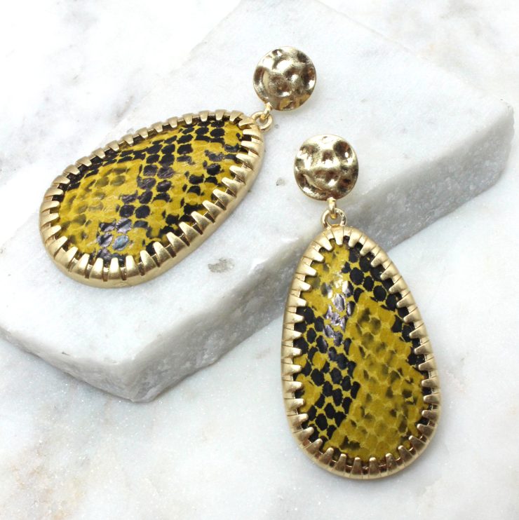 A photo of the Wild Ways Snow Leopard Earrings product