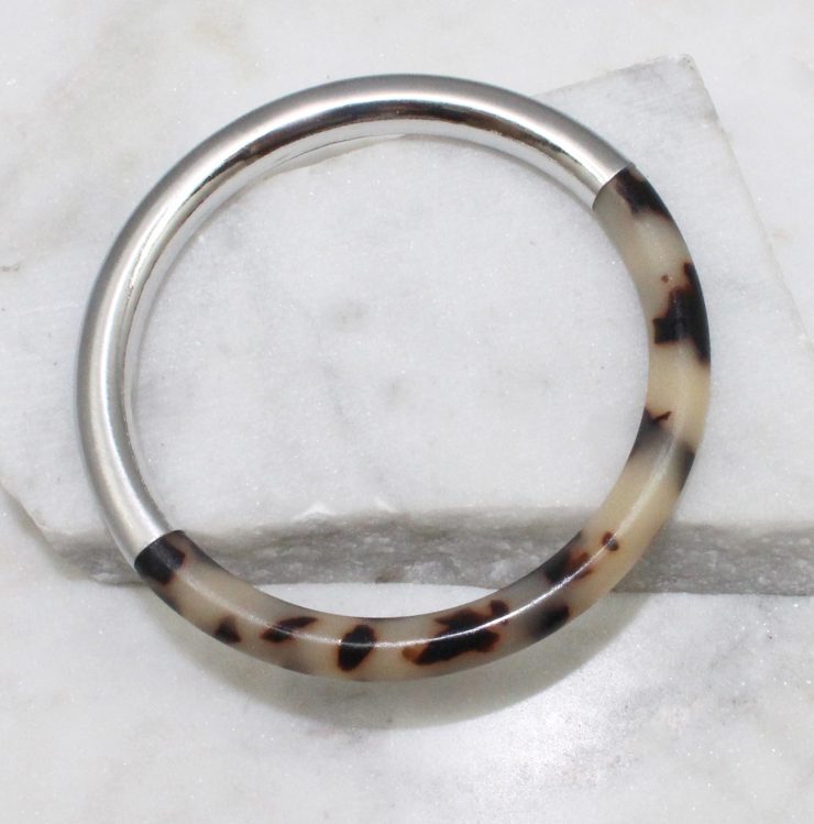 A photo of the Chloe Tortoise Shell Bangle In Silver product