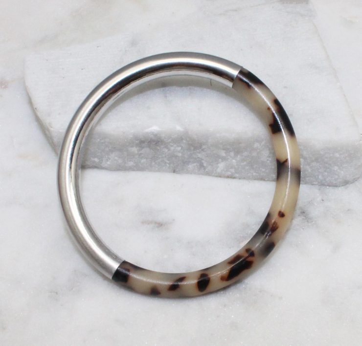 A photo of the Chloe Tortoise Shell Bangle In Silver product