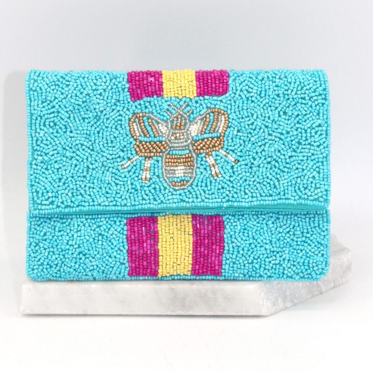 A photo of the Bee Beautiful Mini Clutch in Blue product