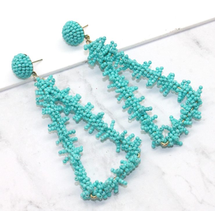 A photo of the Bermuda Triangle Earrings in Turquoise product
