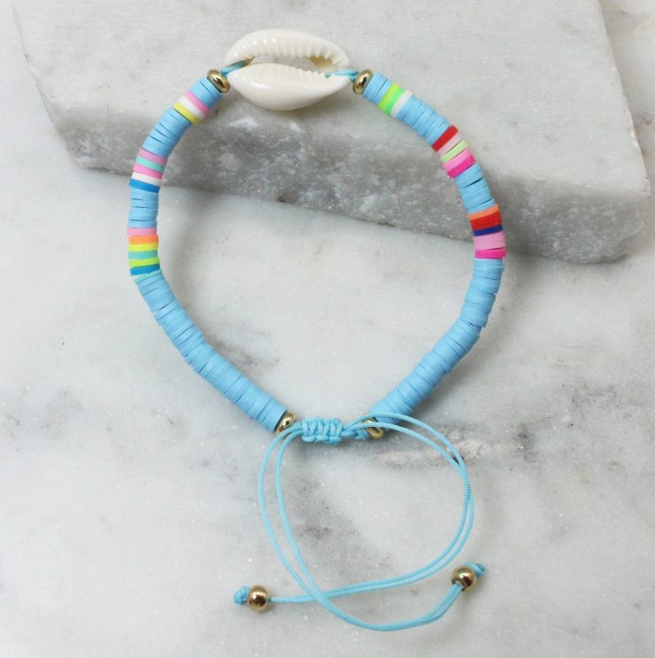 A photo of the Cowrie Shell Adjustable Bracelet In Blue product