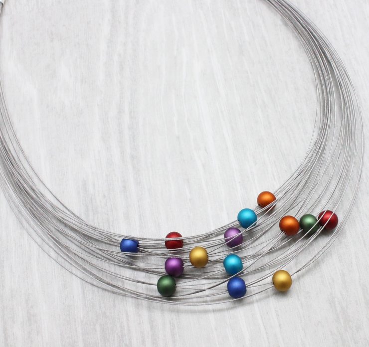 A photo of the Colorful Spheres Necklace product