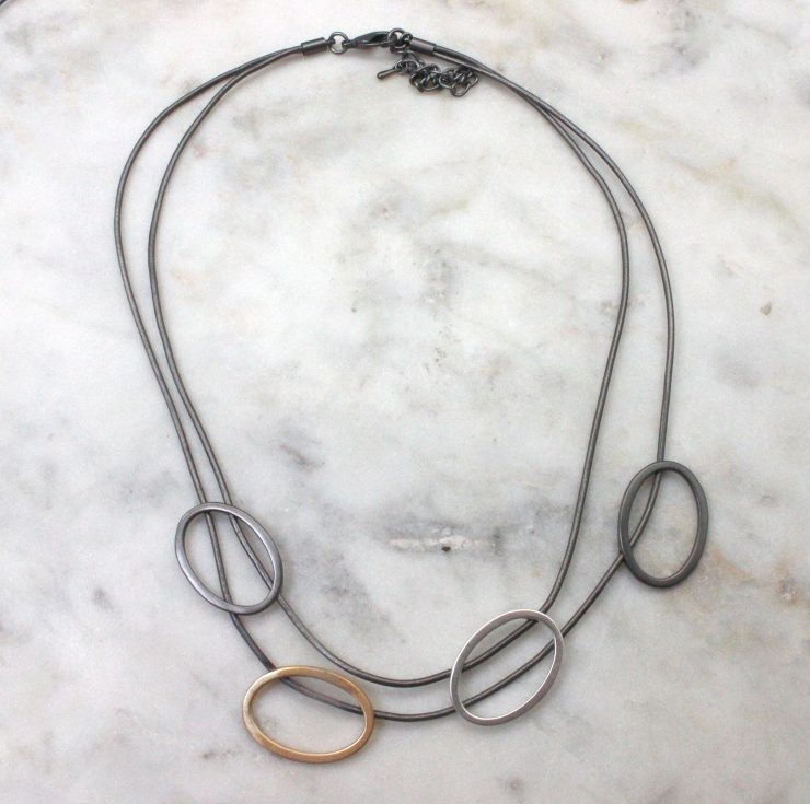A photo of the Double Tri Tone Necklace product