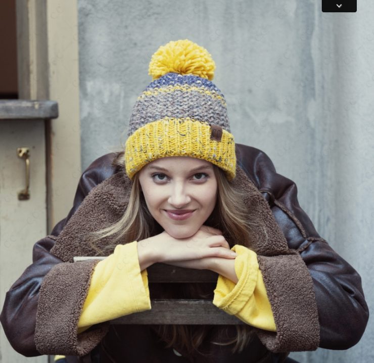 A photo of the Mustard and Blue Pom Pom Hat product