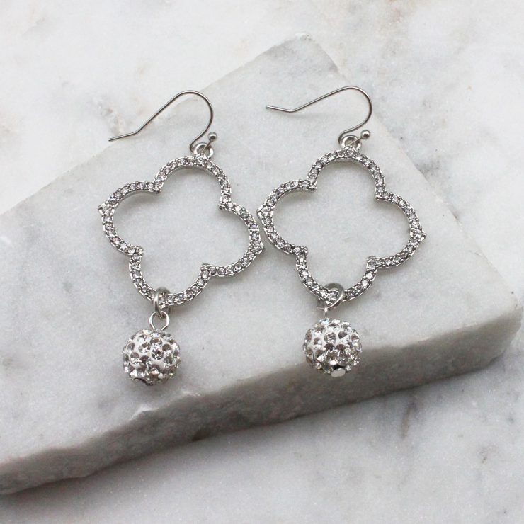 A photo of the Rhinestone Clover Earrings product