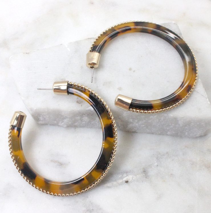 A photo of the Gold Rim Tortoiseshell Hoops product