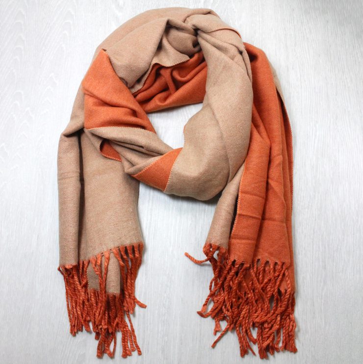 A photo of the Two Tone Scarf in Orange and Tan product