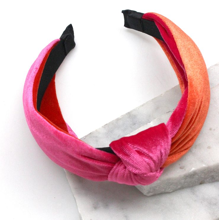 A photo of the Velvet Knot Headband in Pink & Orange product