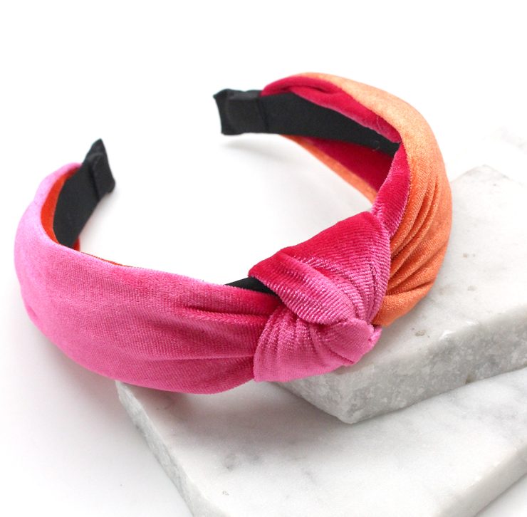 A photo of the Velvet Knot Headband in Pink & Orange product