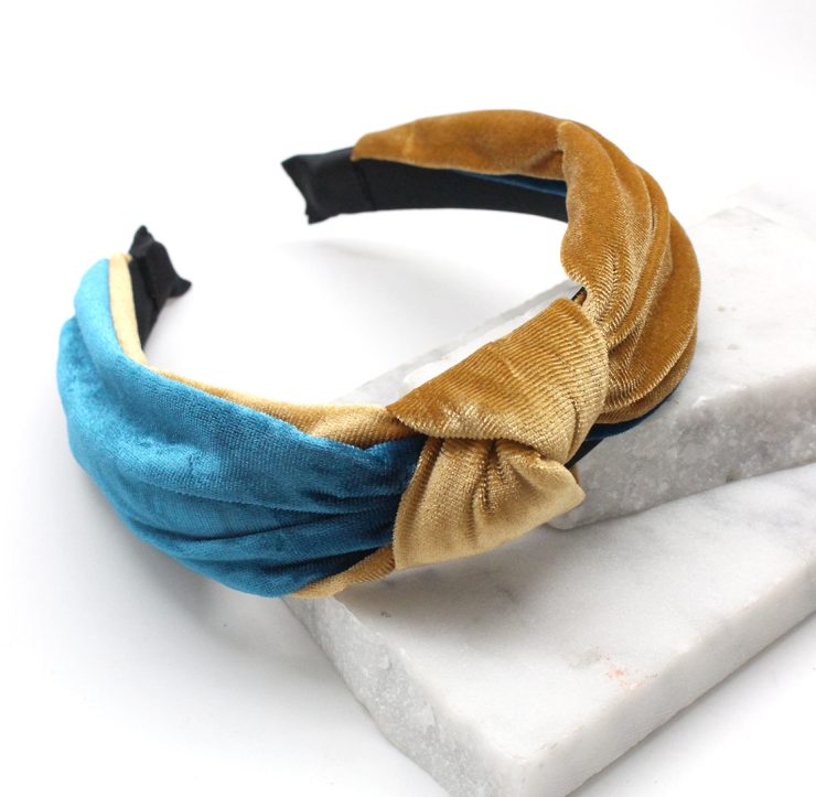 A photo of the Velvet Knot Headband in Teal & Gold product