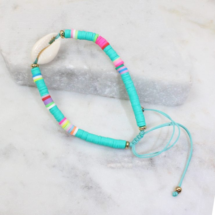 A photo of the Cowrie Shell Adjustable Bracelet In Turquoise product