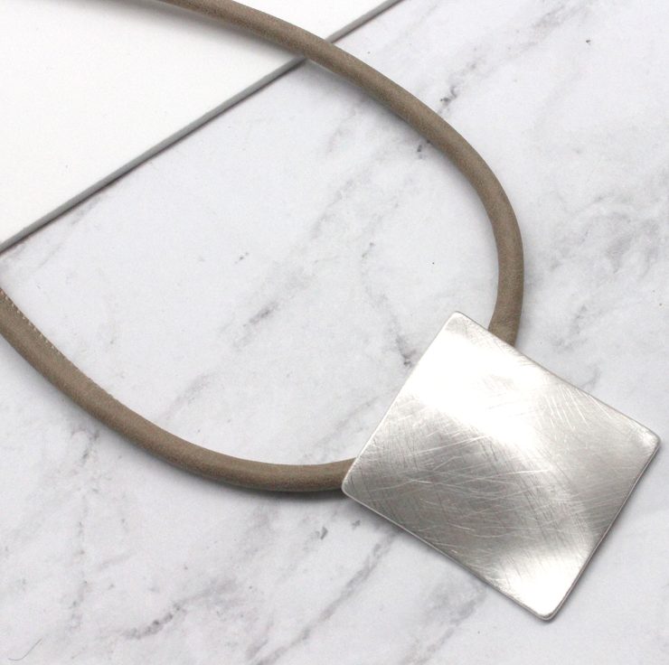 A photo of the Matte Square Necklace product