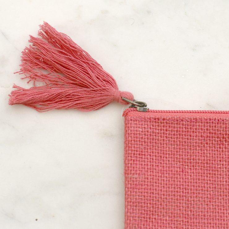 A photo of the Cosmetic Pouch in Coral product