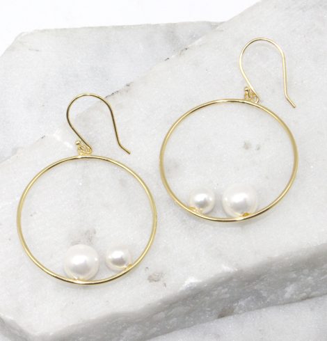 A photo of the Double Pearl Hoop Earrings product