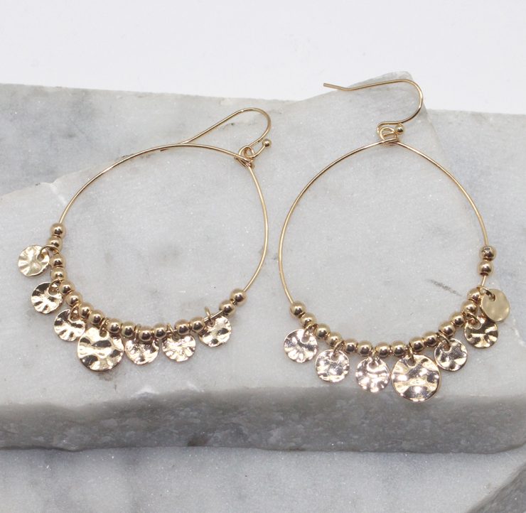 A photo of the Jingle Hoop Earrings in Two Tone product