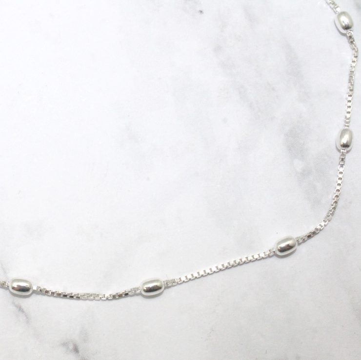A photo of the Kidney Bean Ankle Bracelet product