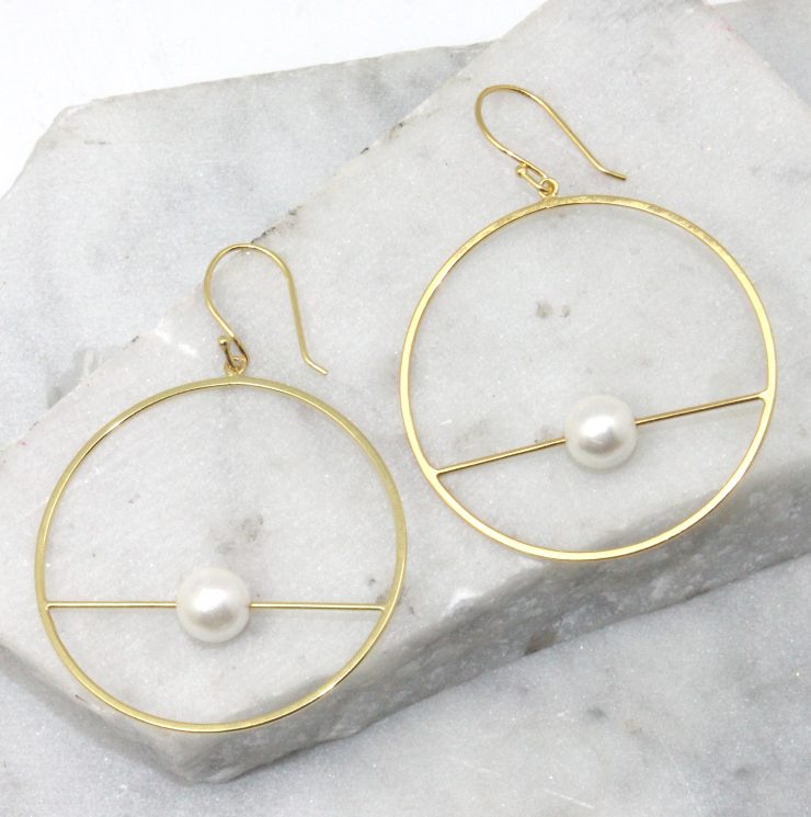 A photo of the Orbit Earrings product