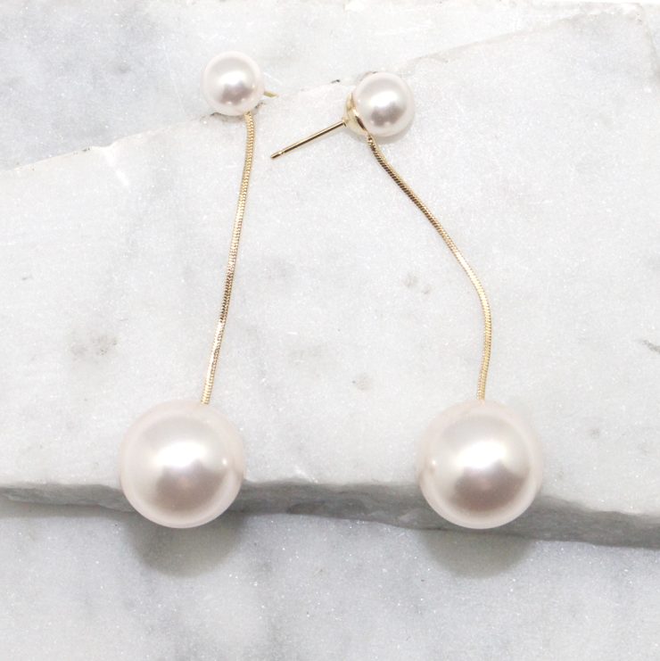 A photo of the Pristine Pearl Earrings product