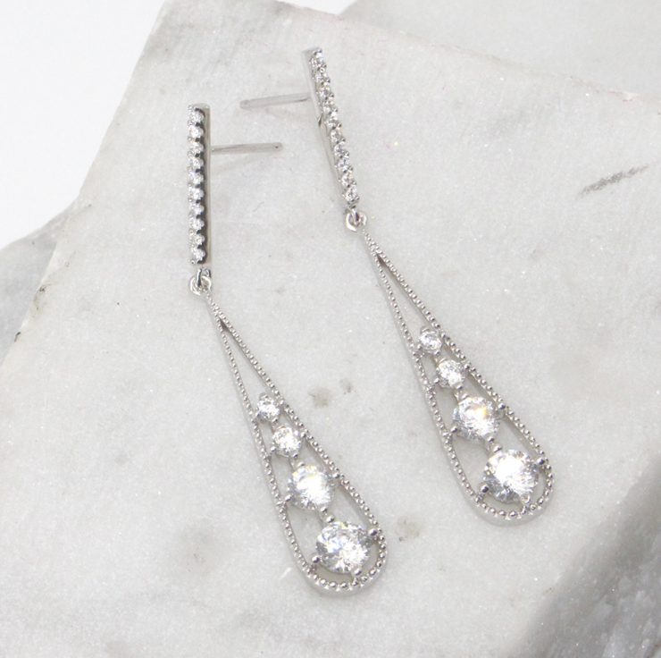 A photo of the Rhinestone Drop Earrings product