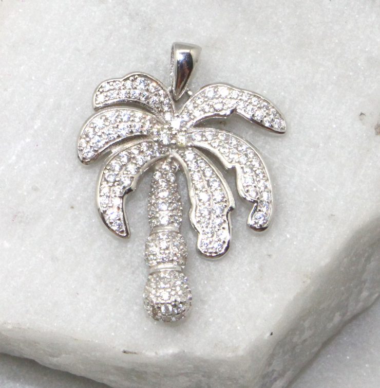 A photo of the Rhinestone Palm Pendant product