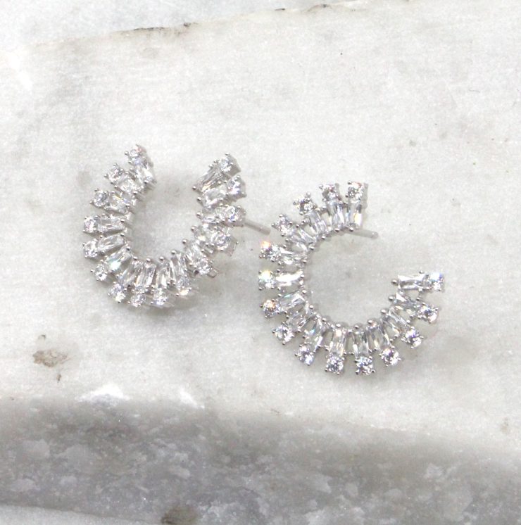 A photo of the Rhinestone Rim Earrings product