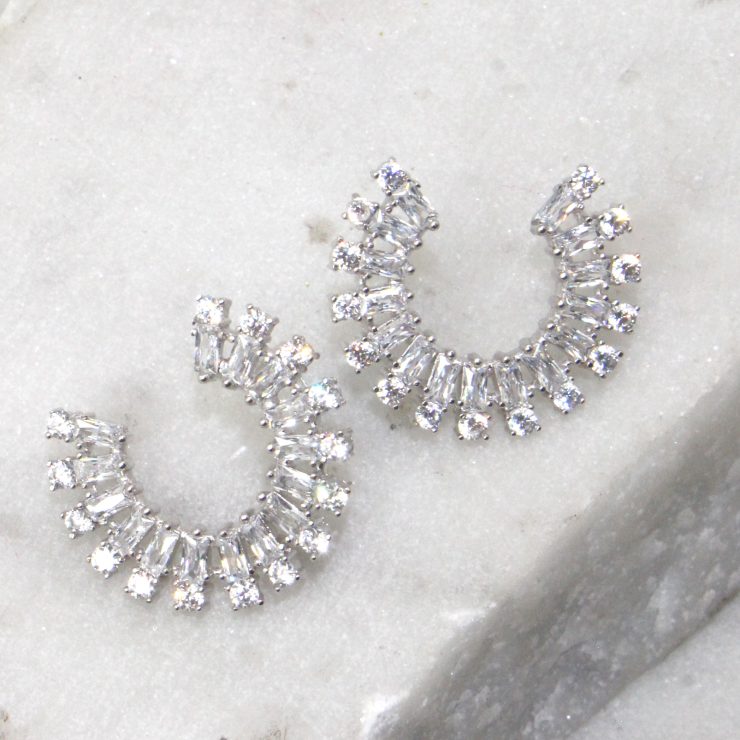 A photo of the Rhinestone Rim Earrings product