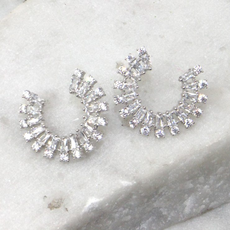 A photo of the Rhinestone Rim Earrings product