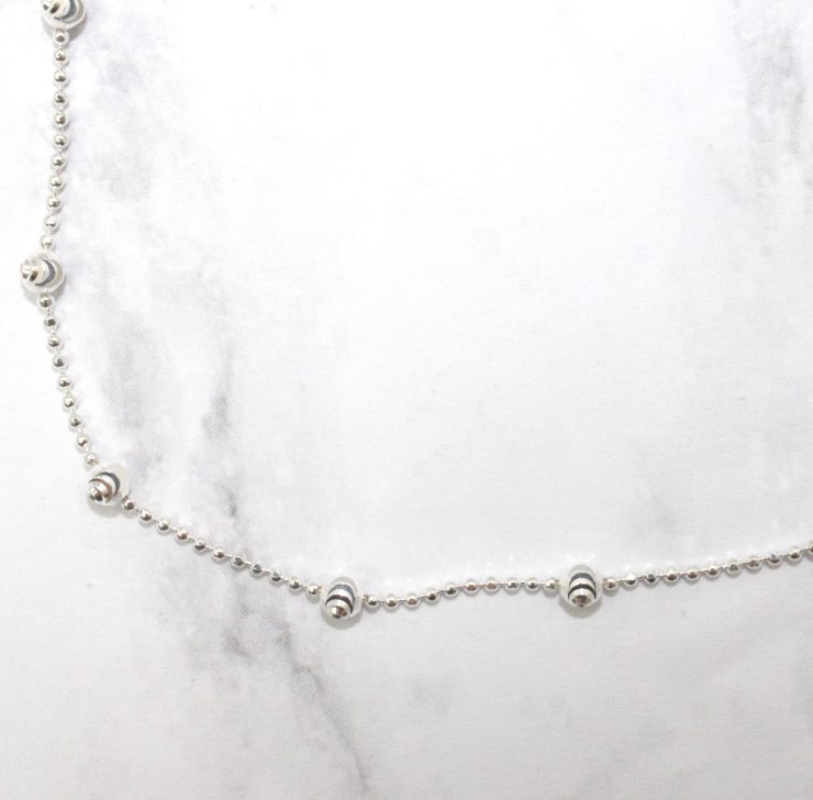 A photo of the Spiral Cut Ankle Bracelet product