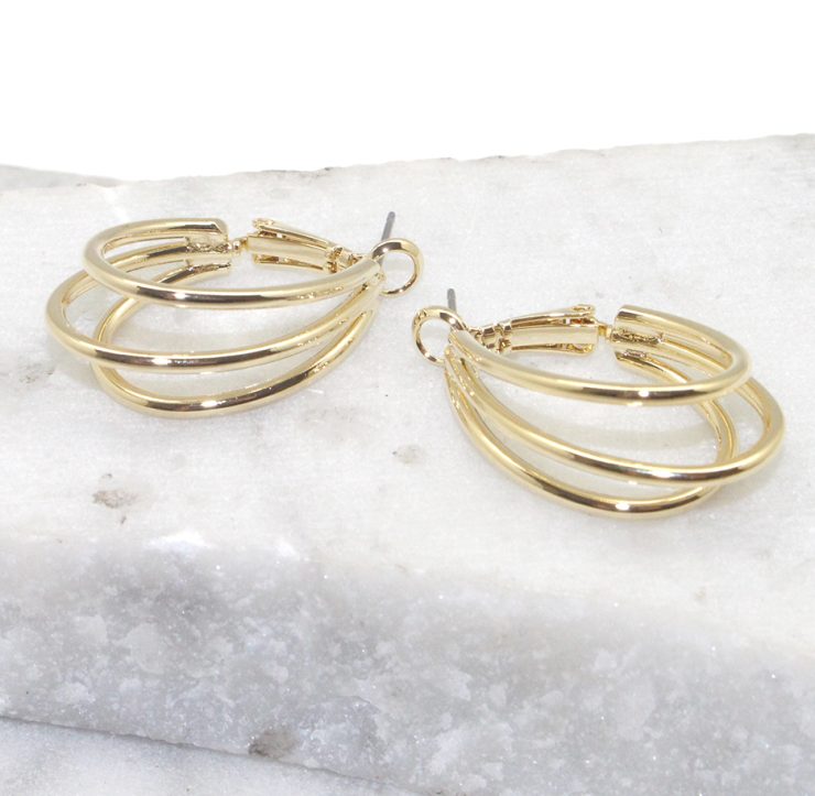 A photo of the Triple Threat Hoop Earrings product