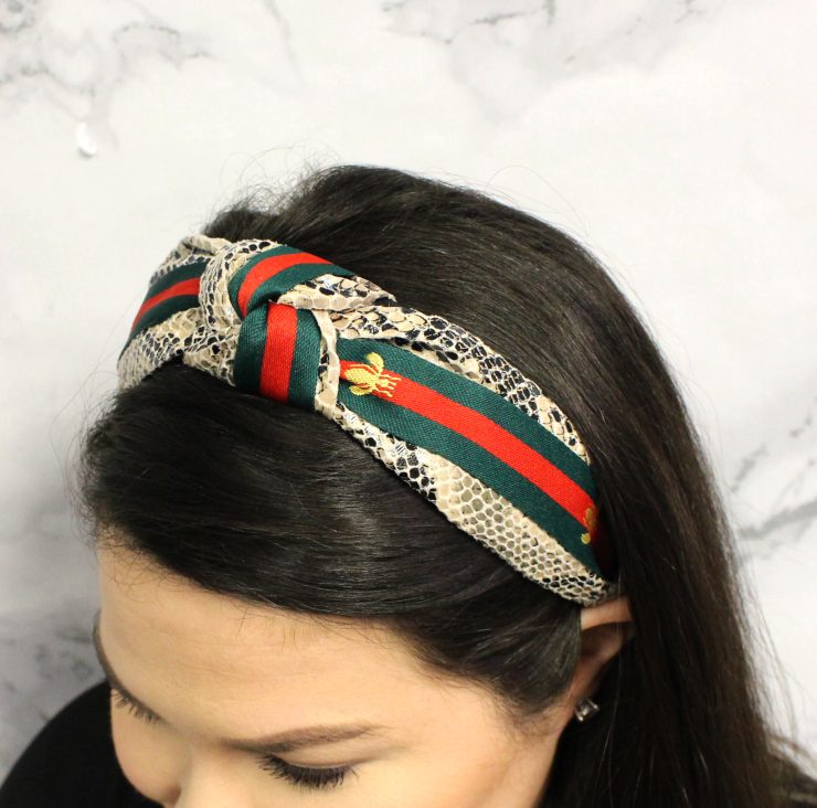 A photo of the Snake Knot Bee Headband product
