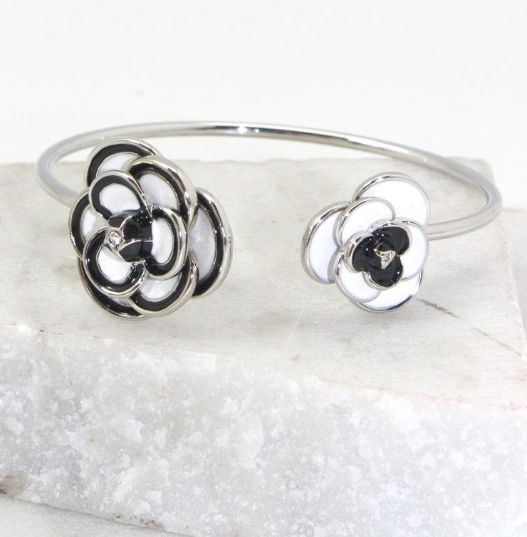 A photo of the Black and White Rose Cuff Bracelet product