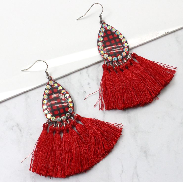 A photo of the Buffalo Check Tassel Earrings product