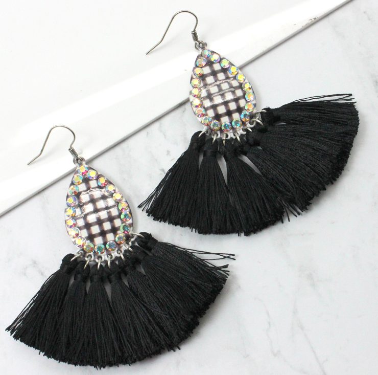 A photo of the Buffalo Check Tassel Earrings product