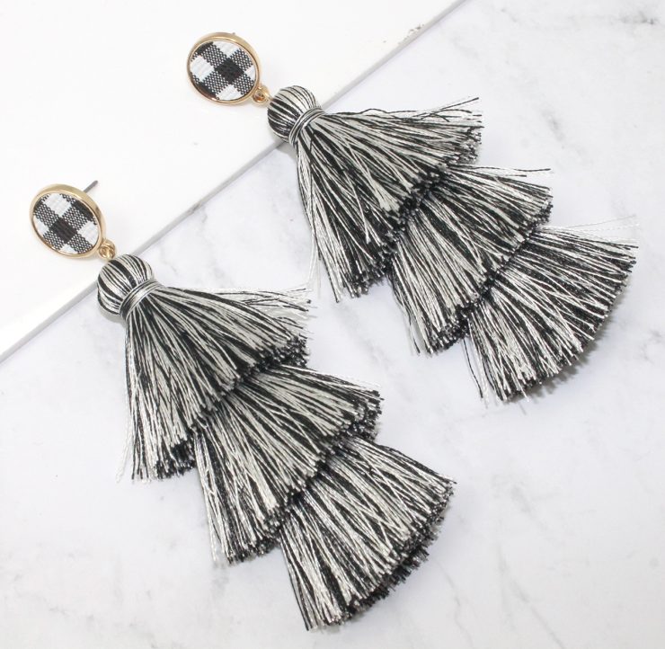 A photo of the Buffalo Check Tiered Earrings product