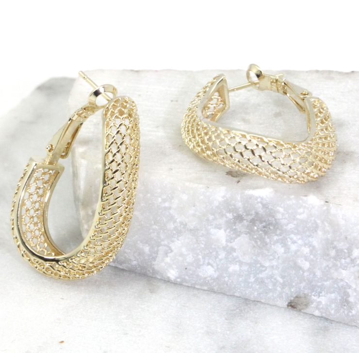 A photo of the Mesh Wave Hoop Earrings product