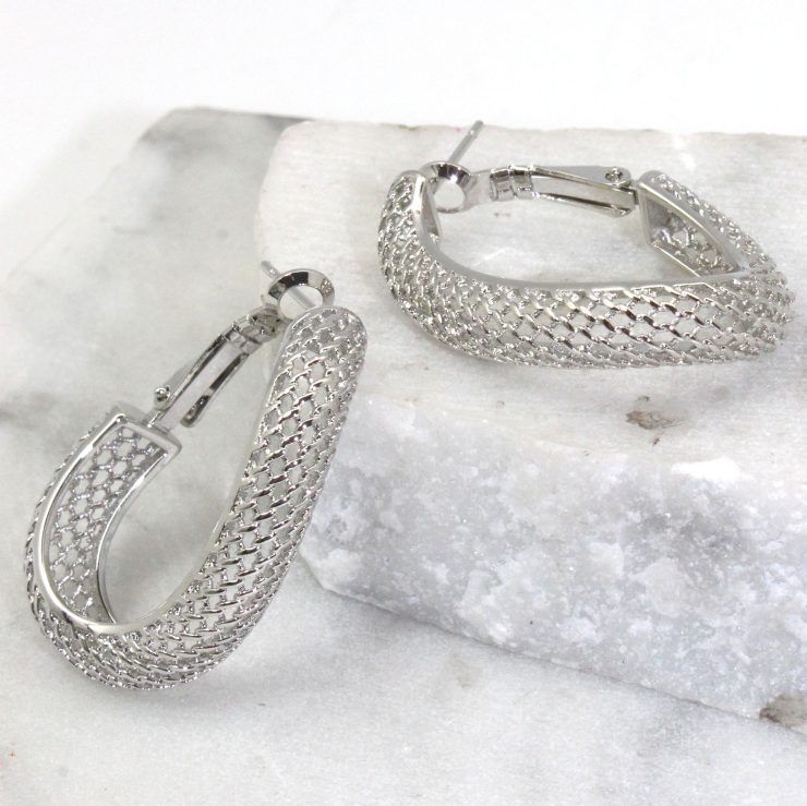 A photo of the Mesh Wave Hoop Earrings product