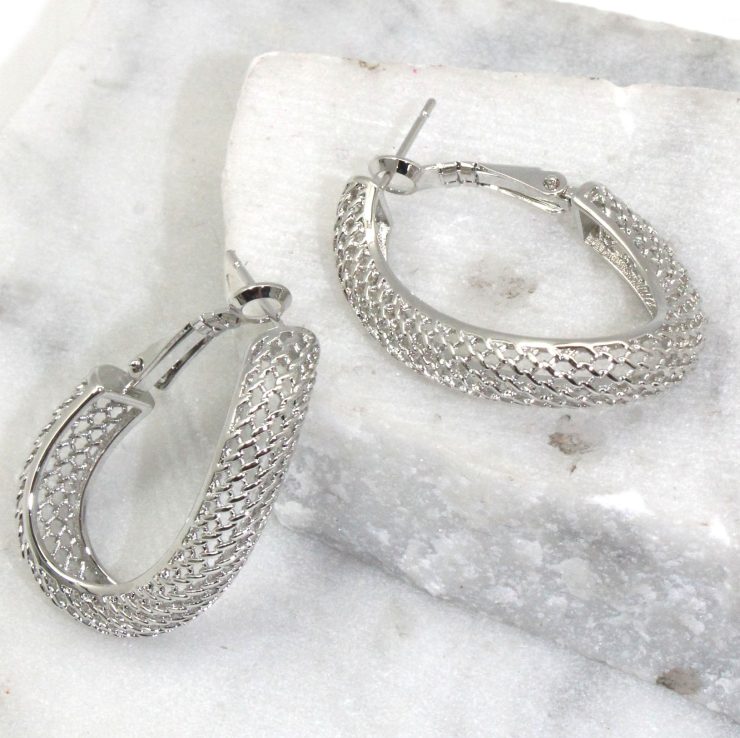 A photo of the Mesh Wave Hoop Earrings product