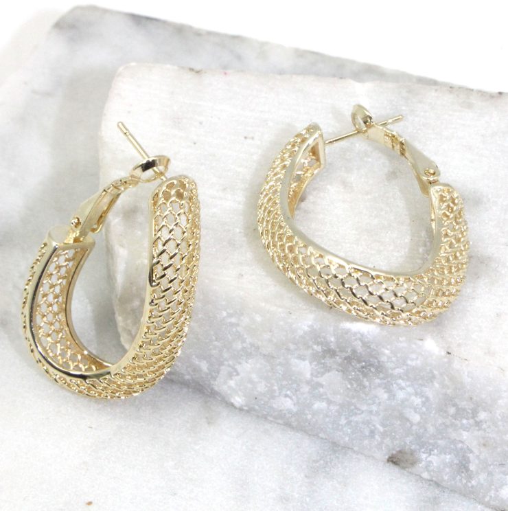 A photo of the Mesh Wave Hoop Earrings product