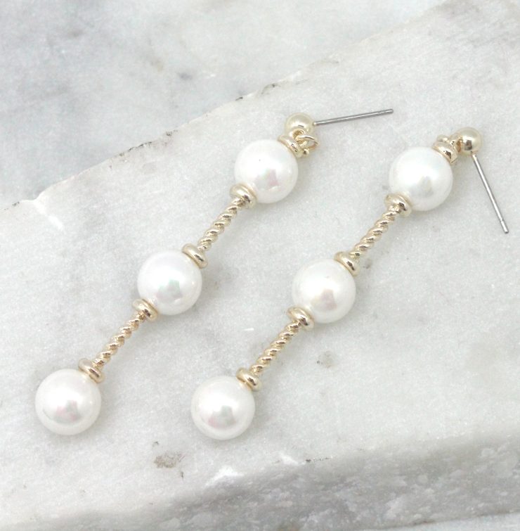 A photo of the Pearl Bar Drop Earrings product