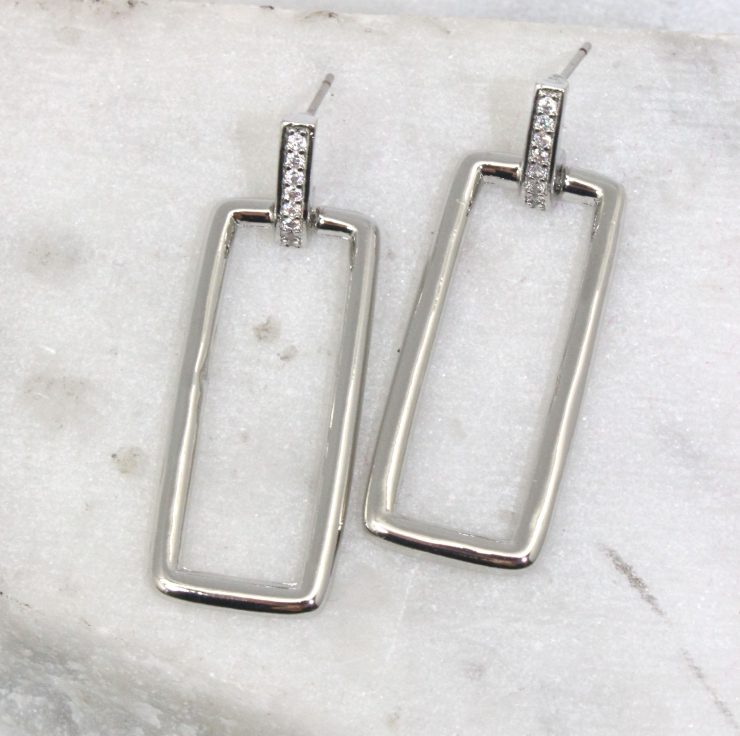 A photo of the Rectangle Link Earrings product