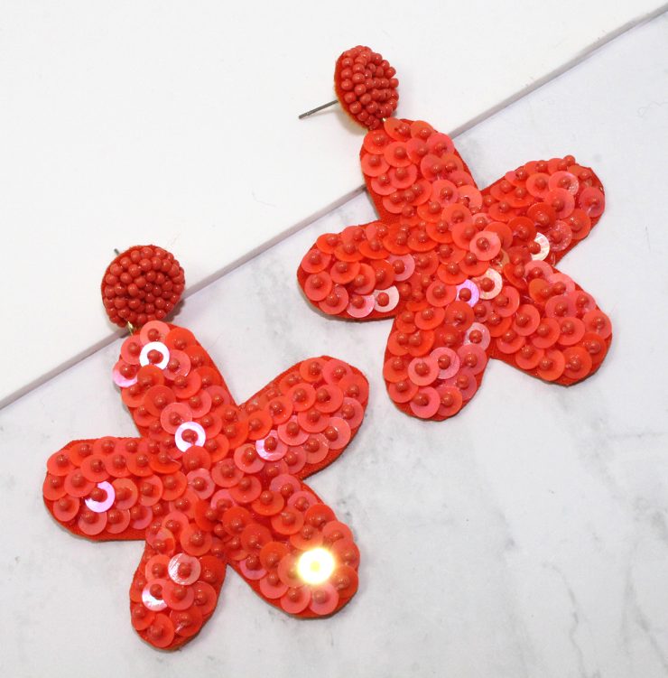 A photo of the Sequin Starfish Earrings product