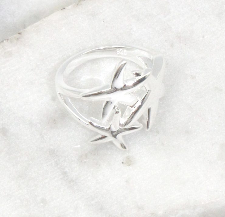 A photo of the Starfish Trio Ring product